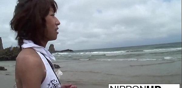  Asian hottie blows her man at the beach